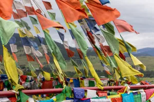 Colorful Buddhist prayer flags strung across the Garden of One Thousand Buddhas in Arlee, Montana